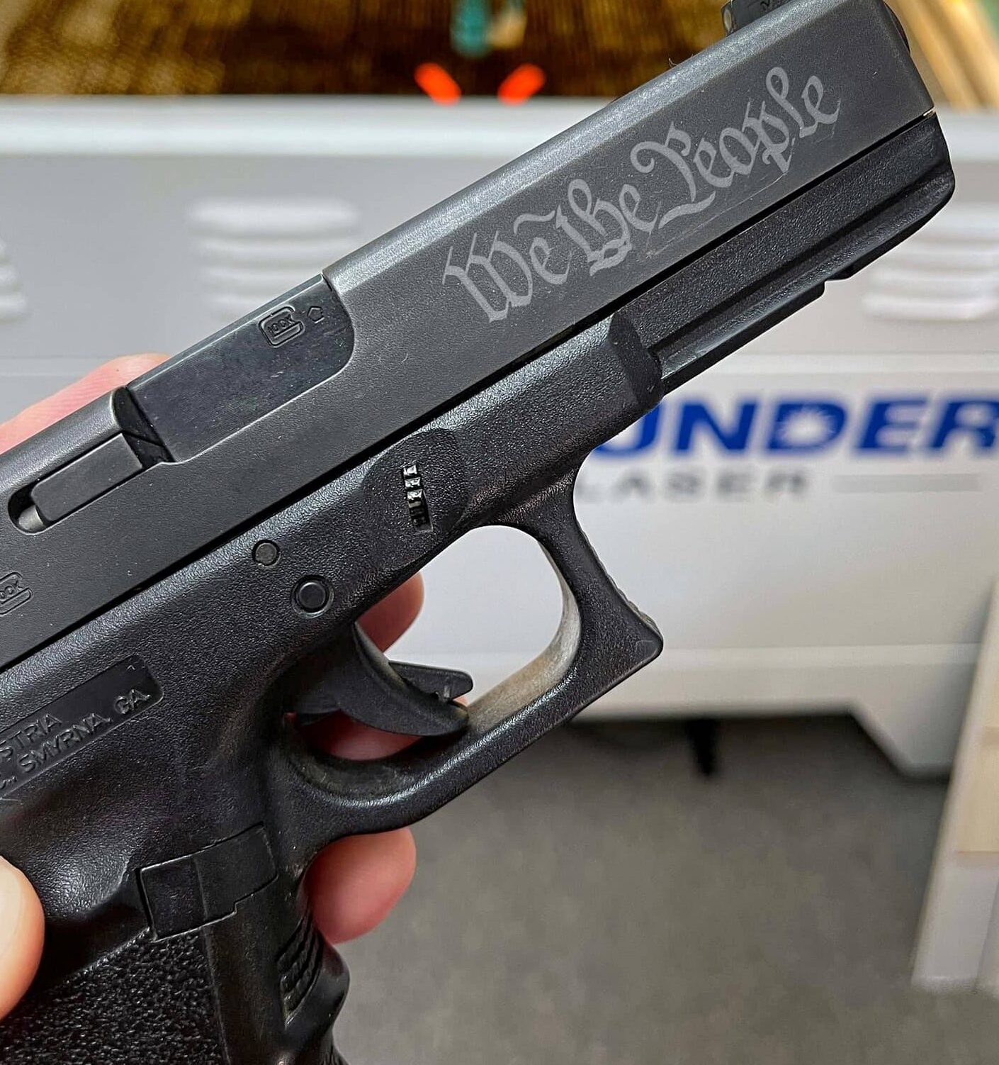Laser engraving a gun