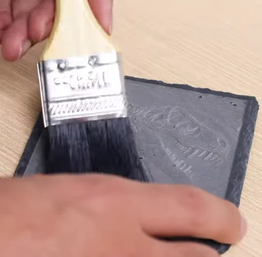 cleaning dinosaur fossil replicas