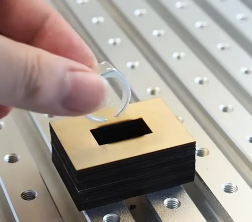 putting the silver ring in the jig
