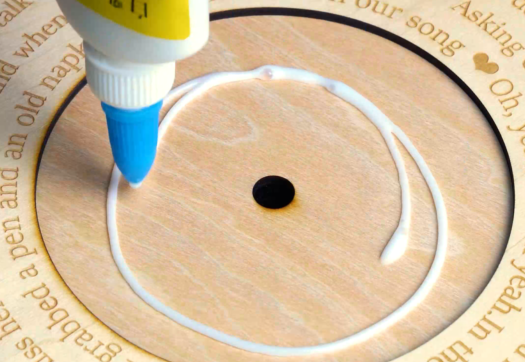 use glue to stick them together to make a laser engraved CD decor with your couple names