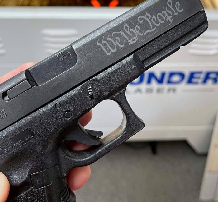 Laser engraving a gun