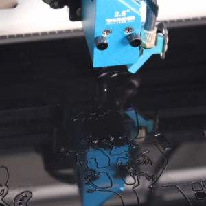Laser cutting black acrylic for making a laser cut halloween door decor