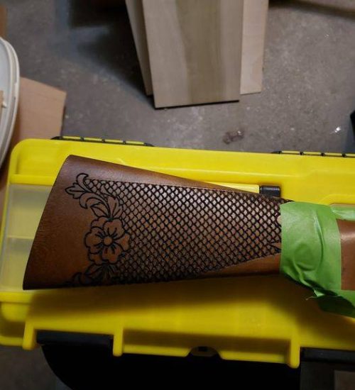 Laser engraving a gun