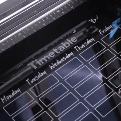 Laser engraving the weekly planner on the acrylic